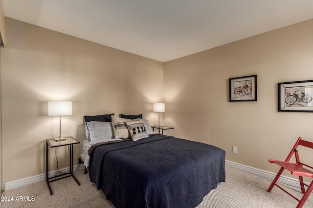 bedroom featuring light carpet