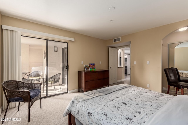 carpeted bedroom with a closet and access to outside