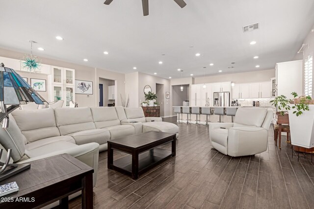 12035 S 186th Ave, Goodyear, AZ 85338 - living area featuring ceiling fan, recessed lighting, and dark wood-style flooring