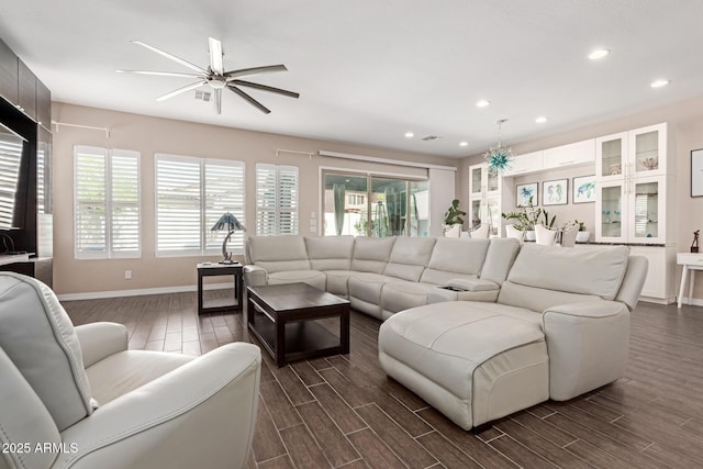 12035 S 186th Ave, Goodyear, AZ 85338 - living room with plenty of natural light, ceiling fan, baseboards, dark wood-type flooring, and recessed lighting