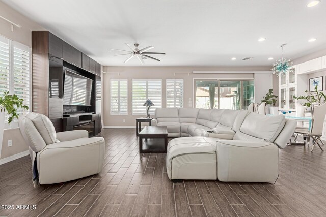 12035 S 186th Ave, Goodyear, AZ 85338 - living room featuring baseboards, healthy amount of natural light, dark wood finished floors, and recessed lighting