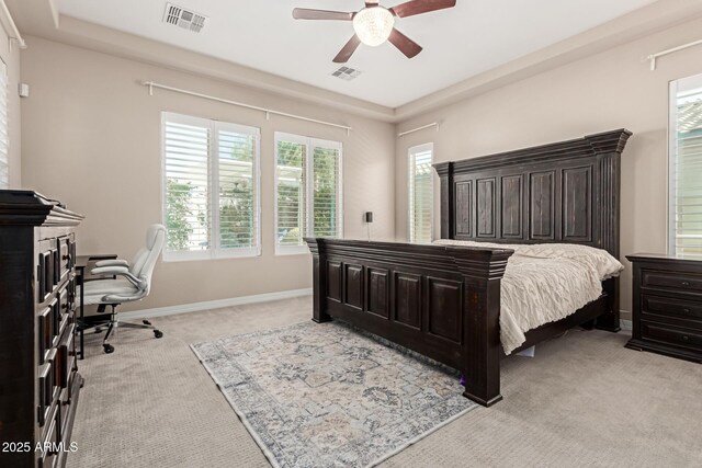 12035 S 186th Ave, Goodyear, AZ 85338 - bedroom with light carpet, a desk, baseboards, and ceiling fan