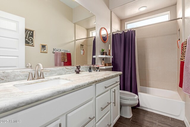 12035 S 186th Ave, Goodyear, AZ 85338 - full bath featuring vanity, toilet, wood finish floors, and shower / tub combo