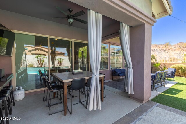 12035 S 186th Ave, Goodyear, AZ 85338 - view of patio with a ceiling fan, outdoor dining space, and a mountain view