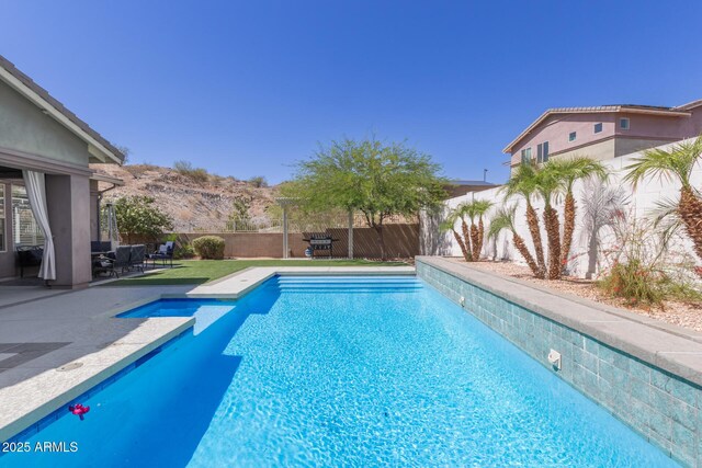 12035 S 186th Ave, Goodyear, AZ 85338 - view of swimming pool featuring a fenced backyard and a patio area