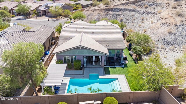 12035 S 186th Ave, Goodyear, AZ 85338 - back of property with a fenced backyard, stucco siding, a patio, and a residential view