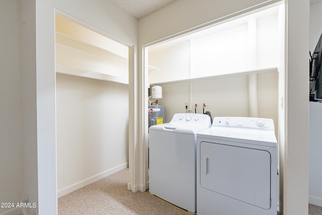 washroom featuring light carpet and independent washer and dryer