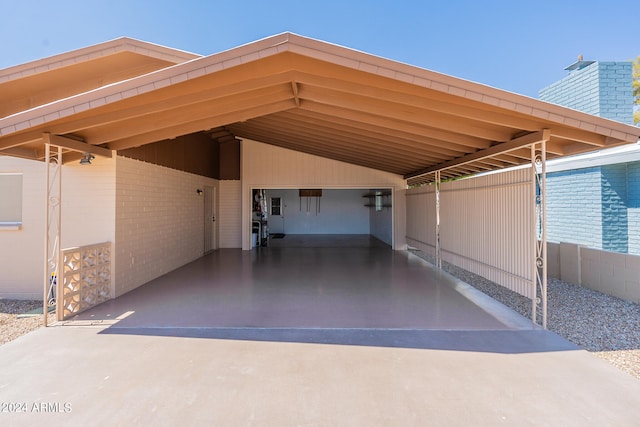 view of vehicle parking with a carport