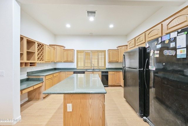 kitchen with freestanding refrigerator, open shelves, a sink, a kitchen island, and recessed lighting