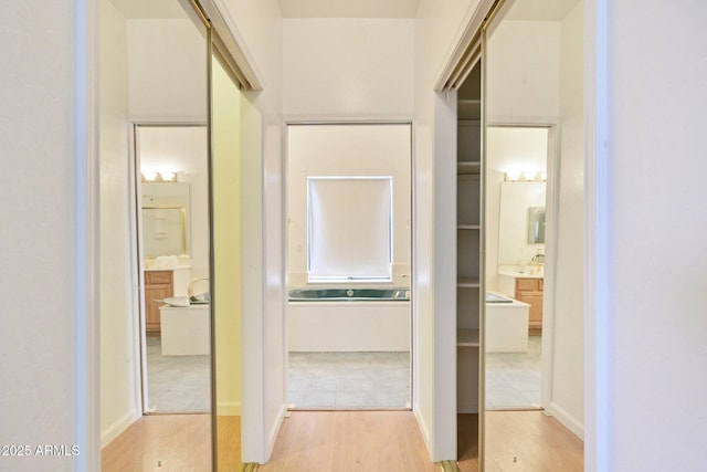 hall with light wood-type flooring