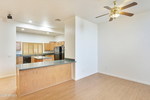 kitchen featuring black appliances, light wood-type flooring, recessed lighting, baseboards, and a peninsula