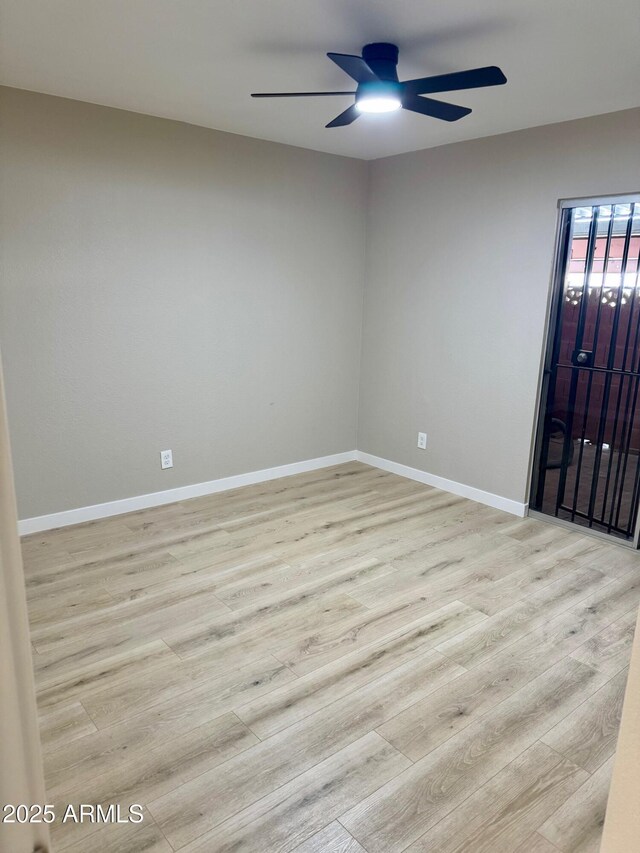 6810 N 35th Ave Unit H, Phoenix, AZ 85017 - empty room with a ceiling fan, light wood-style flooring, and baseboards