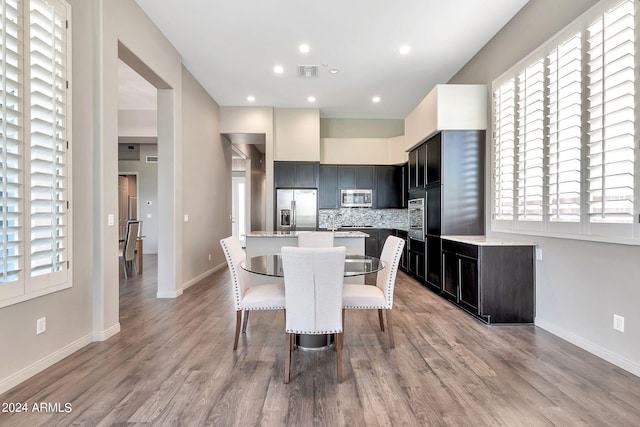 dining area with light hardwood / wood-style floors