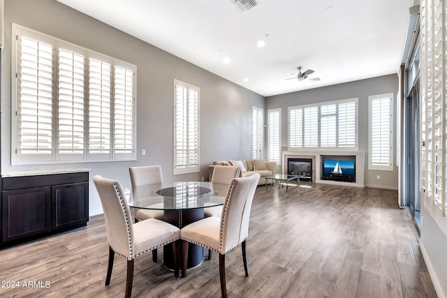 dining room with light wood-type flooring and ceiling fan