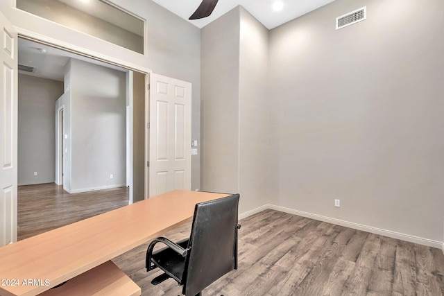 office space featuring ceiling fan and hardwood / wood-style flooring