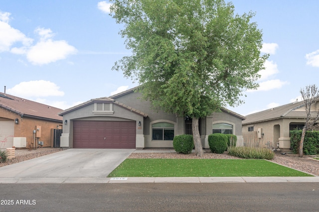 1015 E Penny Ln, San Tan Valley, AZ 85140 - view of front of home featuring an attached garage, stucco siding, and concrete driveway