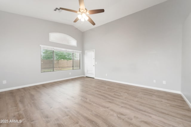 1015 E Penny Ln, San Tan Valley, AZ 85140 - spare room with wood finished floors, baseboards, a ceiling fan, and high vaulted ceiling