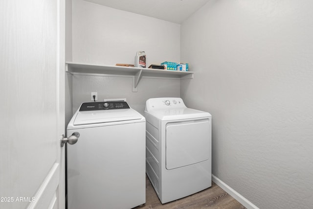 1015 E Penny Ln, San Tan Valley, AZ 85140 - laundry room with separate washer and dryer, wood finished floors, and baseboards