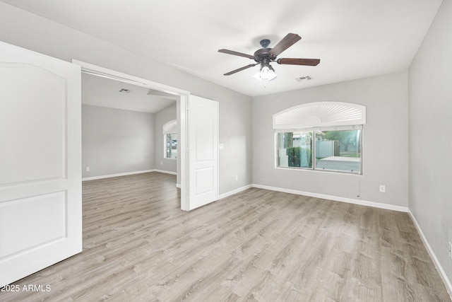 1015 E Penny Ln, San Tan Valley, AZ 85140 - spare room with ceiling fan, light wood-type flooring, and baseboards