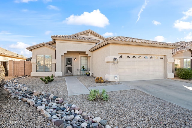 2537 E Vista Bonita Dr, Phoenix, AZ 85024 - mediterranean / spanish house with stucco siding, fence, a tiled roof, driveway, and a garage