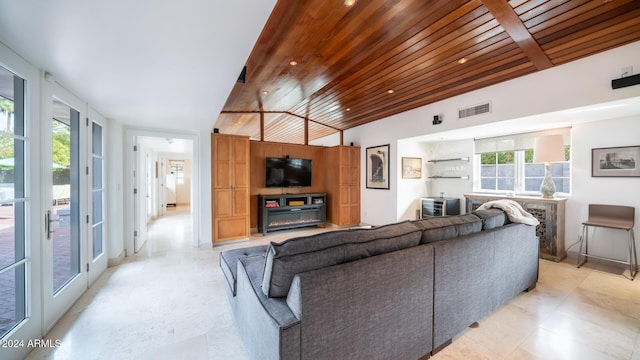 living room featuring a healthy amount of sunlight, wooden ceiling, and vaulted ceiling