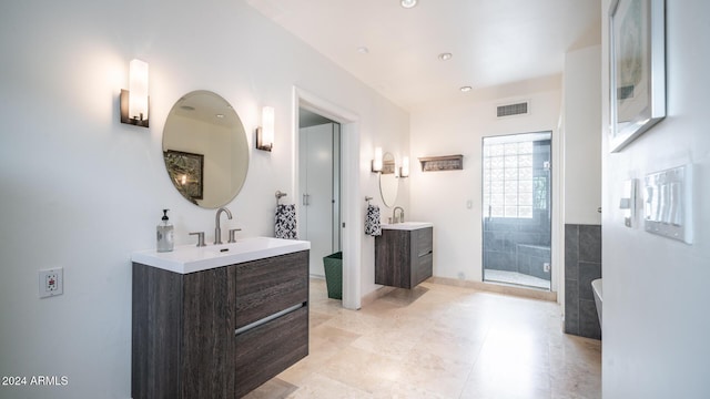 bathroom with tile patterned flooring, vanity, and a shower with shower door