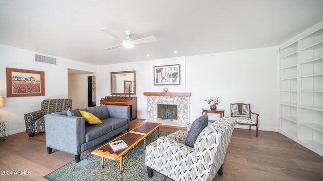 living room with hardwood / wood-style floors and ceiling fan