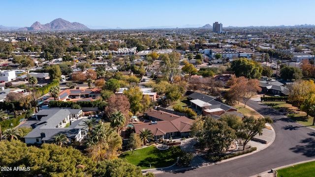 birds eye view of property with a mountain view