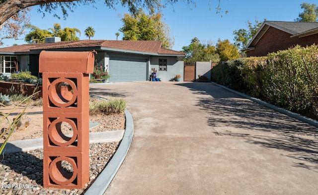 ranch-style home featuring a garage