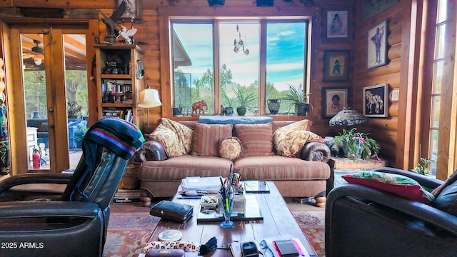 living room with rustic walls and plenty of natural light