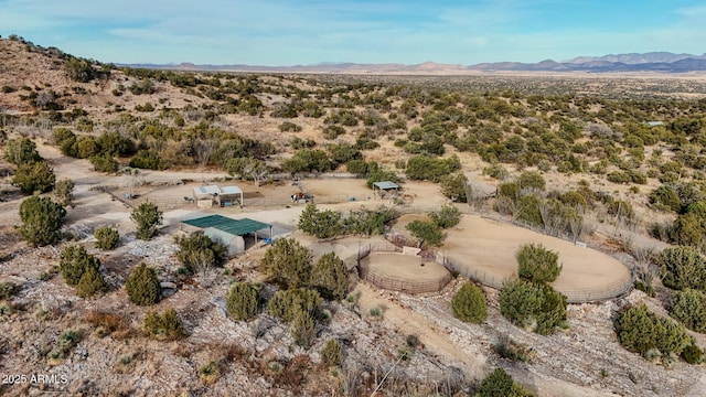 birds eye view of property with a mountain view