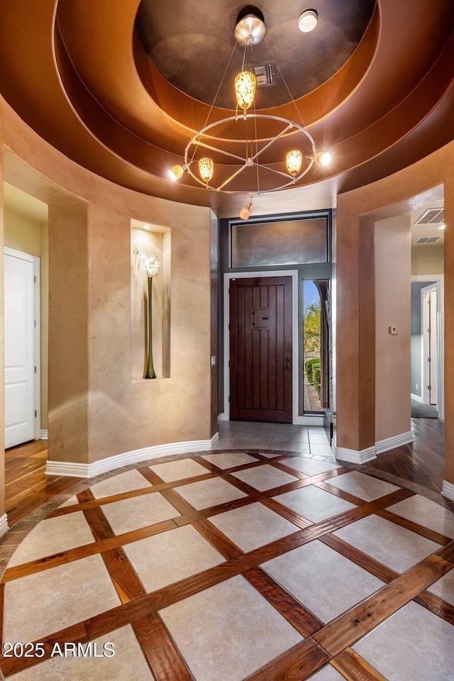 entrance foyer featuring a tray ceiling