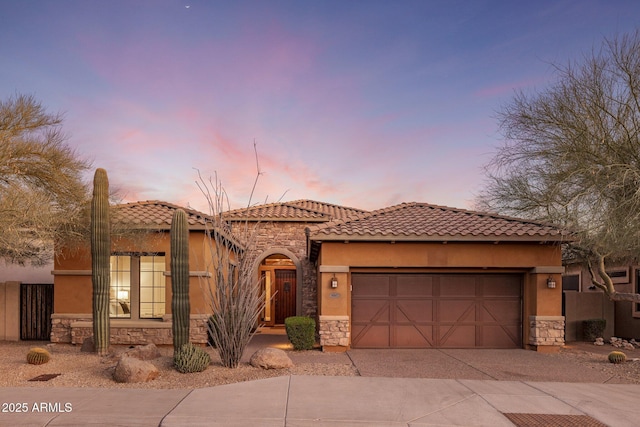 mediterranean / spanish-style home featuring a garage