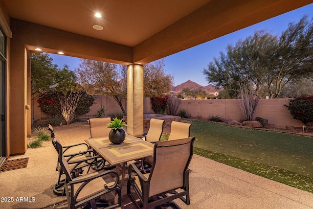 patio terrace at dusk with a yard