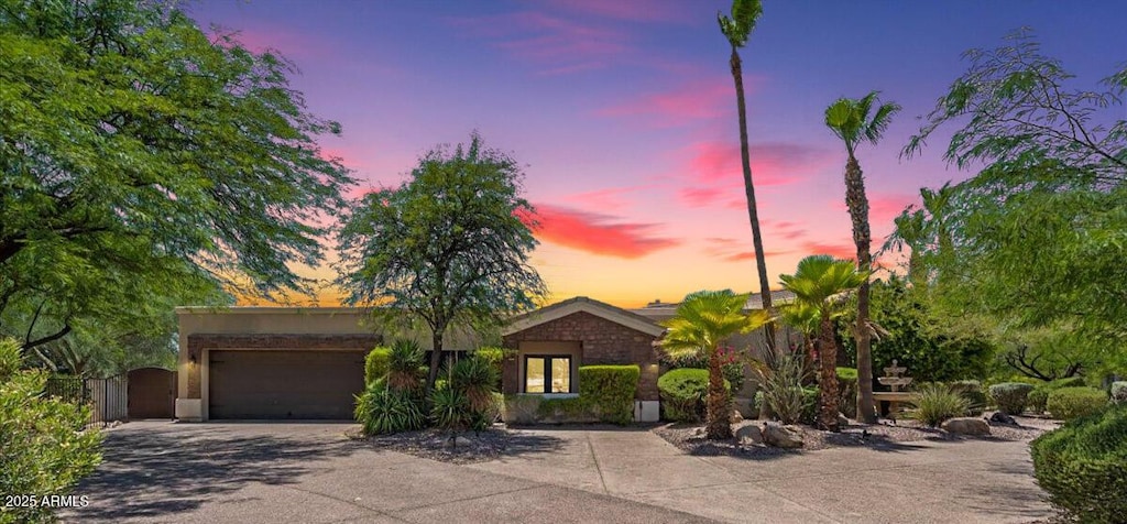 10290 N 117th Pl, Scottsdale, AZ 85259 - ranch-style house featuring an attached garage and driveway