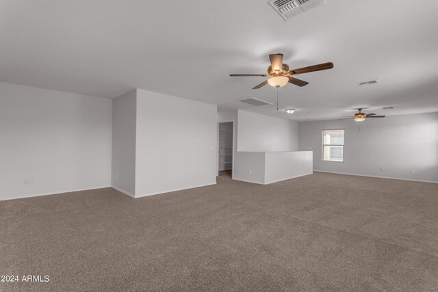 unfurnished room featuring carpet floors and ceiling fan