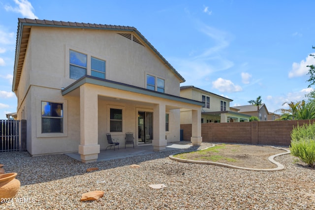 rear view of house with a patio area