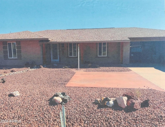 ranch-style house with a patio