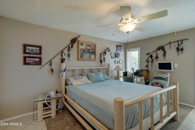 tiled bedroom with ceiling fan