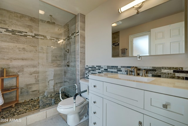 bathroom featuring tile patterned floors, walk in shower, vanity, and toilet