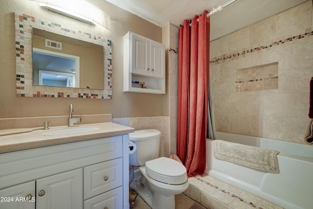 full bathroom featuring vanity, toilet, and shower / bathtub combination with curtain