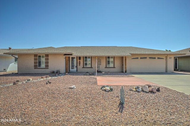 single story home featuring a garage