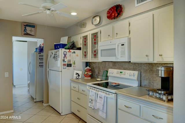 kitchen with white cabinetry, white appliances, backsplash, light tile patterned floors, and ceiling fan