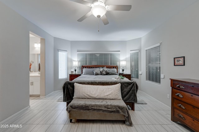 bedroom with ceiling fan and ensuite bathroom