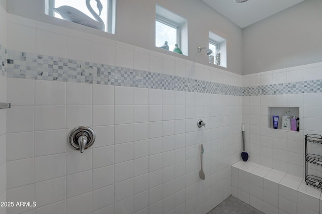 bathroom with tiled shower