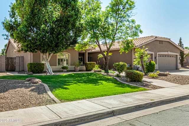 13609 W Vermont Ave, Litchfield Park, AZ 85340 - view of front of house with a tile roof, a front yard, a gate, stucco siding, and a garage