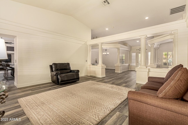 13609 W Vermont Ave, Litchfield Park, AZ 85340 - living area featuring decorative columns, visible vents, lofted ceiling, and dark wood-style flooring