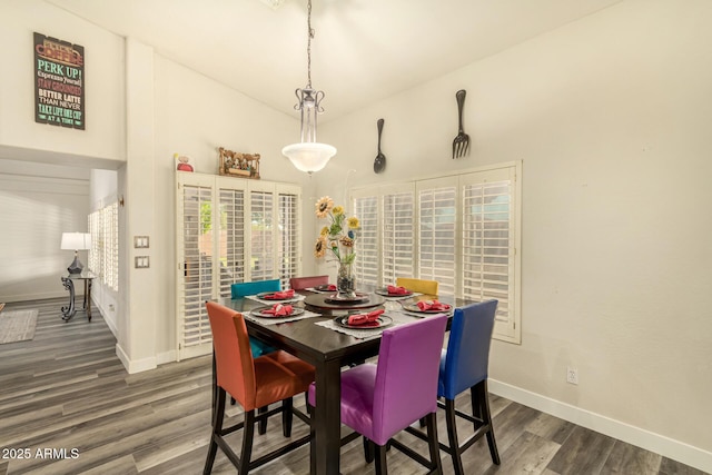 13609 W Vermont Ave, Litchfield Park, AZ 85340 - dining area with baseboards, lofted ceiling, and wood finished floors
