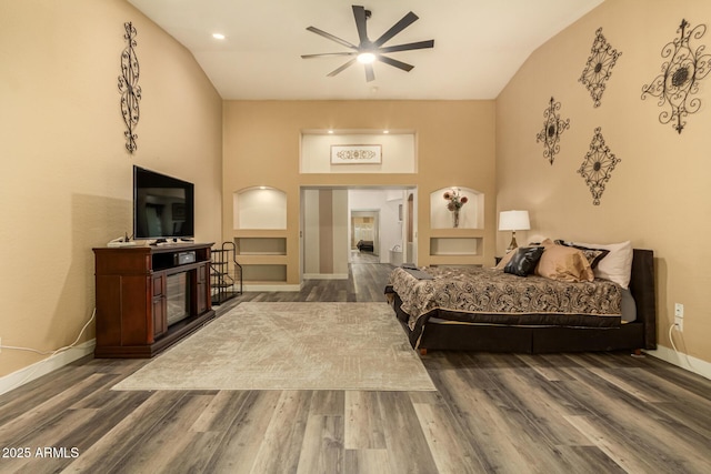 13609 W Vermont Ave, Litchfield Park, AZ 85340 - bedroom featuring baseboards, a fireplace, and wood finished floors