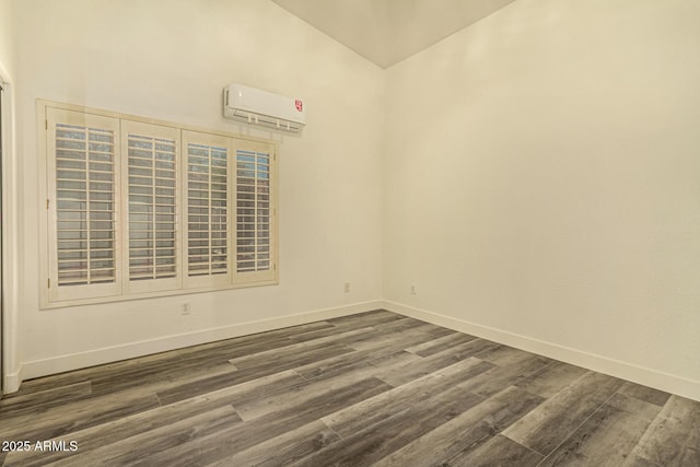 13609 W Vermont Ave, Litchfield Park, AZ 85340 - spare room featuring dark wood-style floors, a wall unit AC, and baseboards
